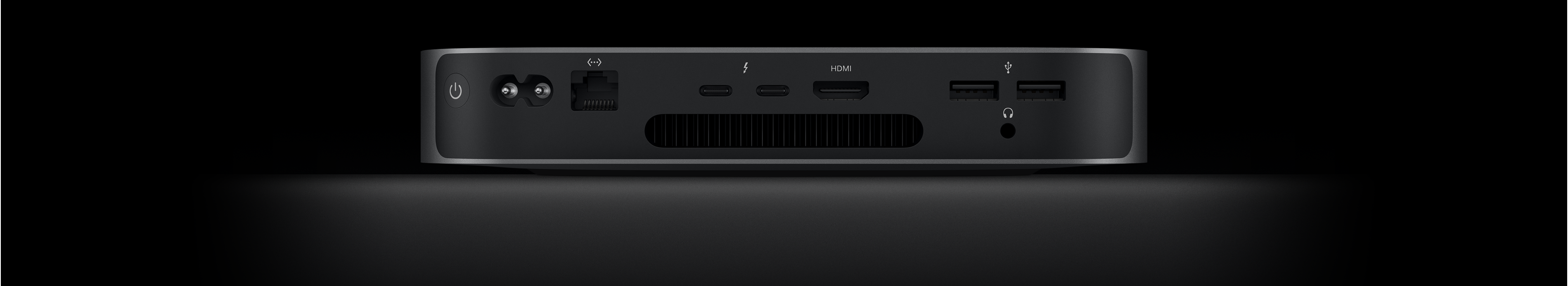 Achteraanzicht van Mac mini met de twee Thunderbolt 4-poorten, HDMI-poort, twee USB‑A-poorten, mini‑jack-aansluiting, Gigabit Ethernet-poort, voedingspoort en aan/uit-knop.